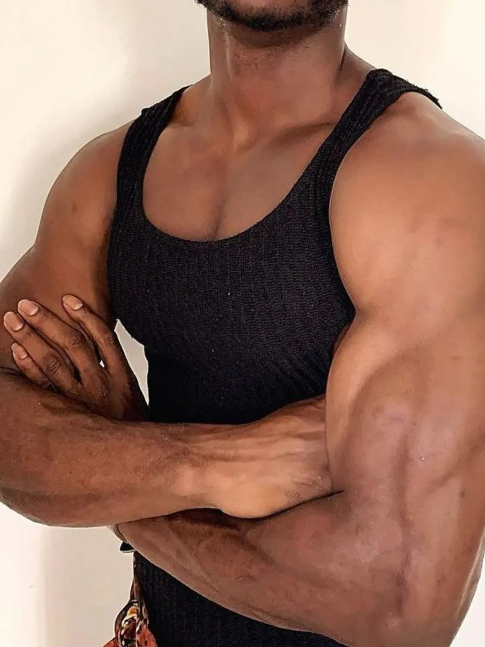 Black ribbed tank top with cutout and side strap detail