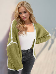 Oversized knit cardigan in Yellow-Green with white contrast stitching detail on sleeves and hem.