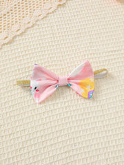 Pink baby headband with bunny and star print bow