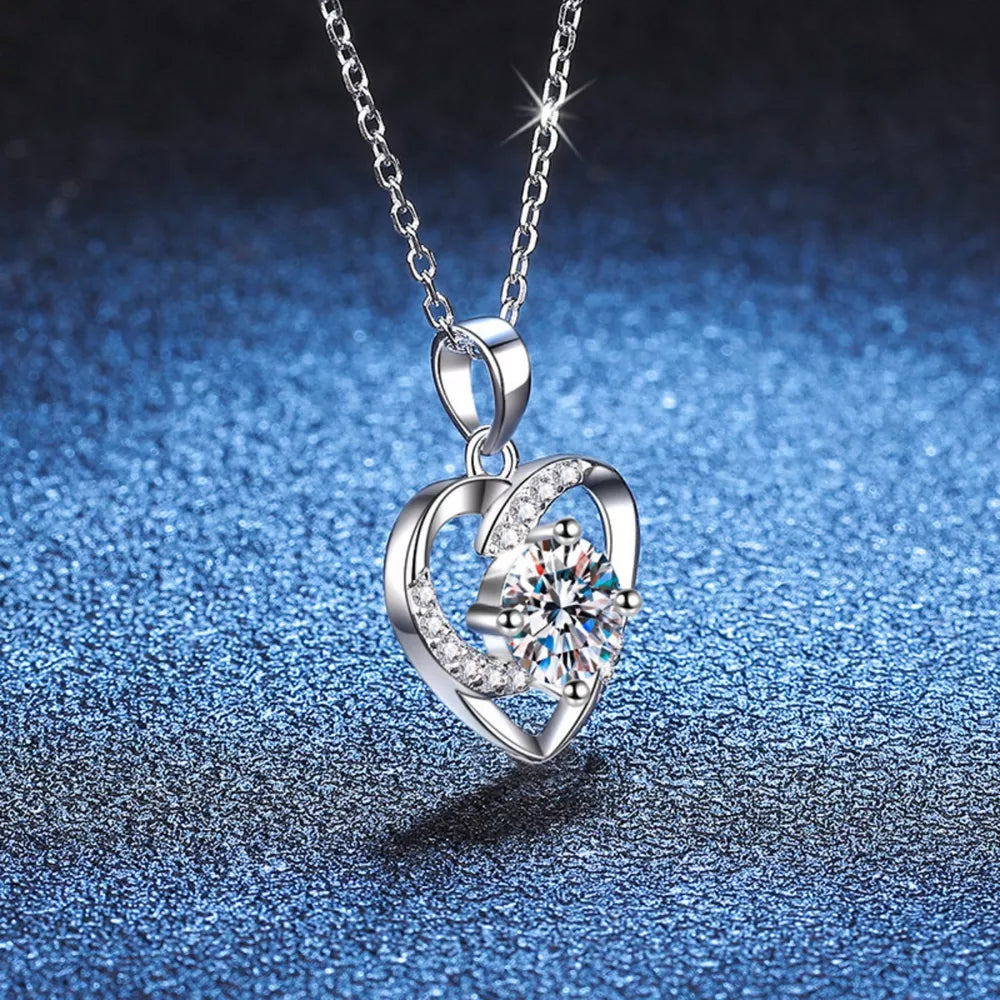 Silver heart pendant necklace with clear zircon and crystal accents.