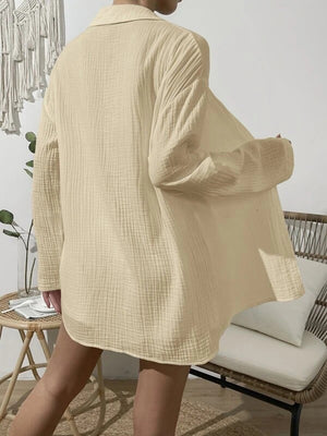 Ivory textured gauze shirt with a relaxed fit and buttoned front, styled as part of a co-ord set.
