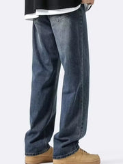 Men's loose-fit vintage wash denim jeans with a relaxed cut.