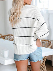 White acrylic open knit cardigan with horizontal black stripes and a relaxed fit.