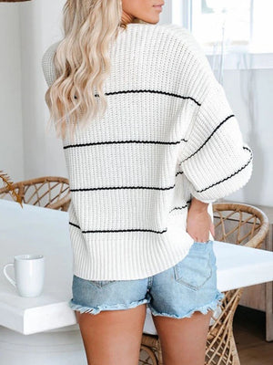 White acrylic open knit cardigan with horizontal black stripes and a relaxed fit.