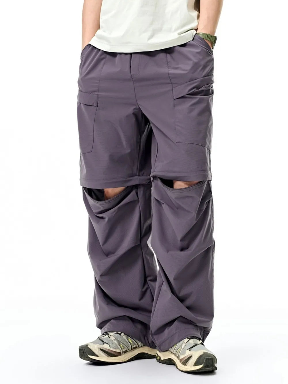 Gray cargo pants with adjustable waist and zip-off legs, shown as shorts.