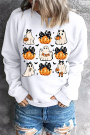 White crewneck sweatshirt with a spooky patchwork graphic of ghosts and pumpkins.