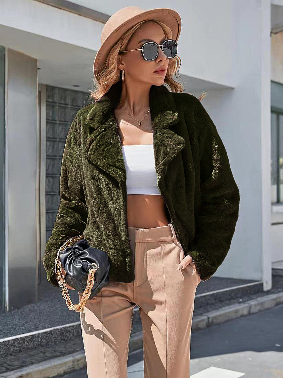 Army green faux fur biker jacket with notched lapels and a relaxed fit.