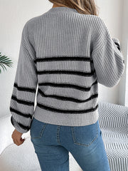 Gray striped knit sweater with mock neck and balloon sleeves.
