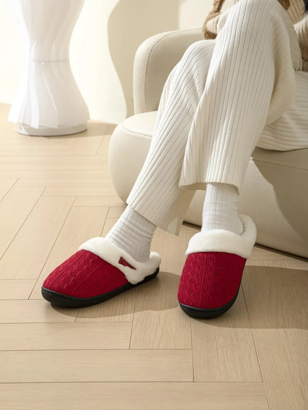 Deep Red cable knit shearling house slippers with white trim.
