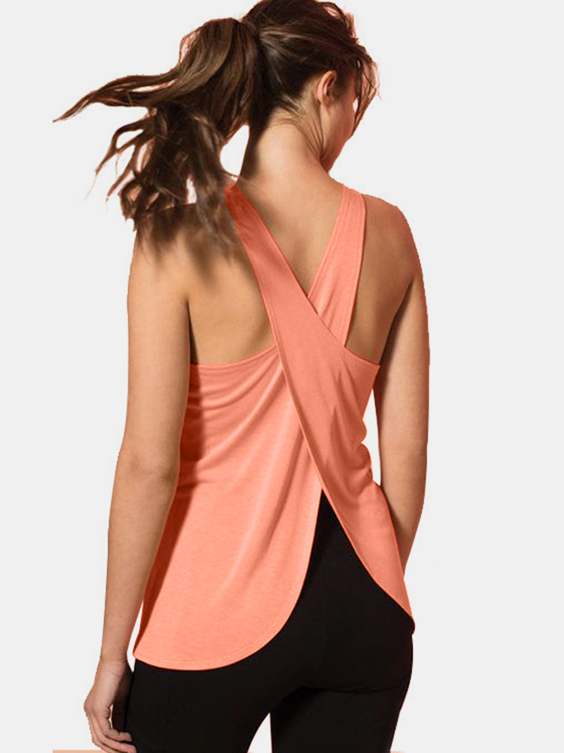 Coral cross-back flow tank top with a split back detail.
