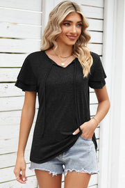 Black flutter sleeve henley tee with tie-neck detail and layered sleeves.