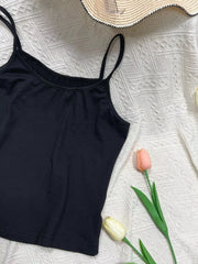 Black cami top with scoop neck and adjustable spaghetti straps.