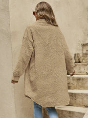 Oversized teddy bear shacket in camel with button-down front and long sleeves.