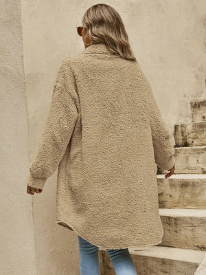 Oversized teddy bear shacket in camel with button-down front and long sleeves.