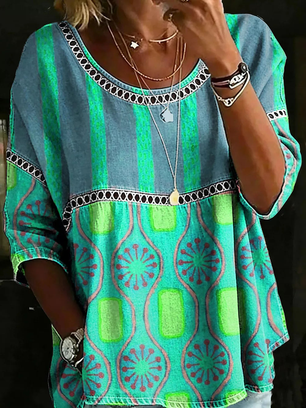 Bohemian maternity t-shirt in blue and green with floral and geometric patterns, openwork neckline detail.