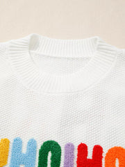 White chenille chunky knit crew neck sweater with colorful fuzzy letters.