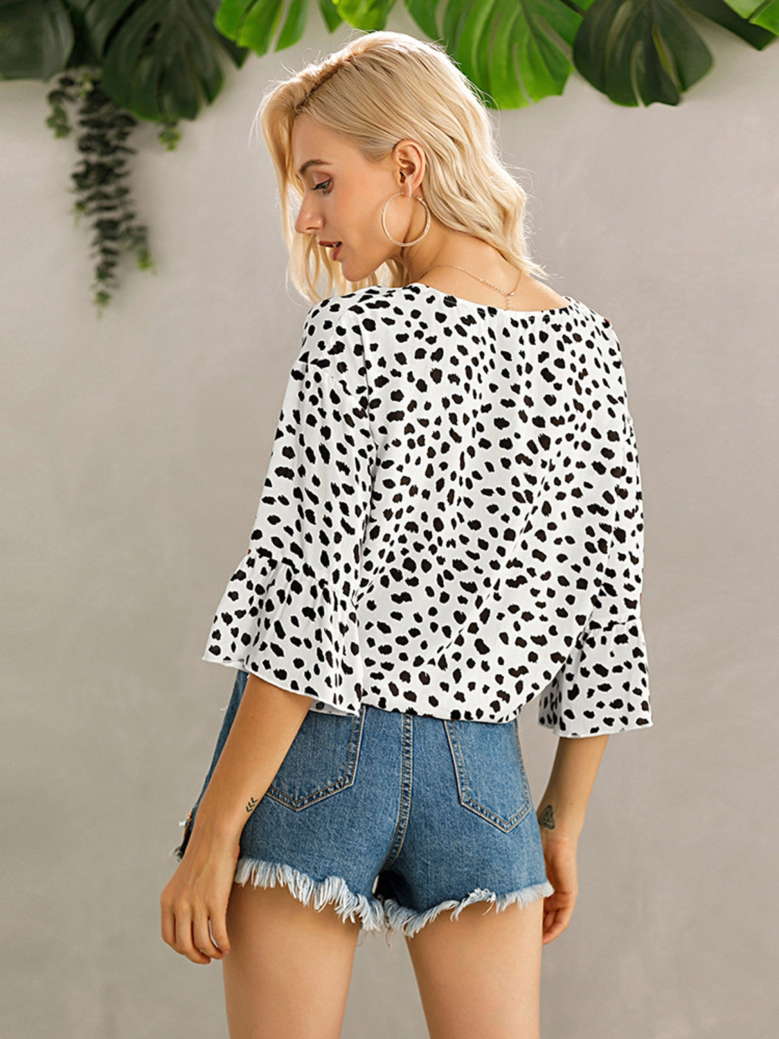 White spotted knot-front blouse with flared sleeves
