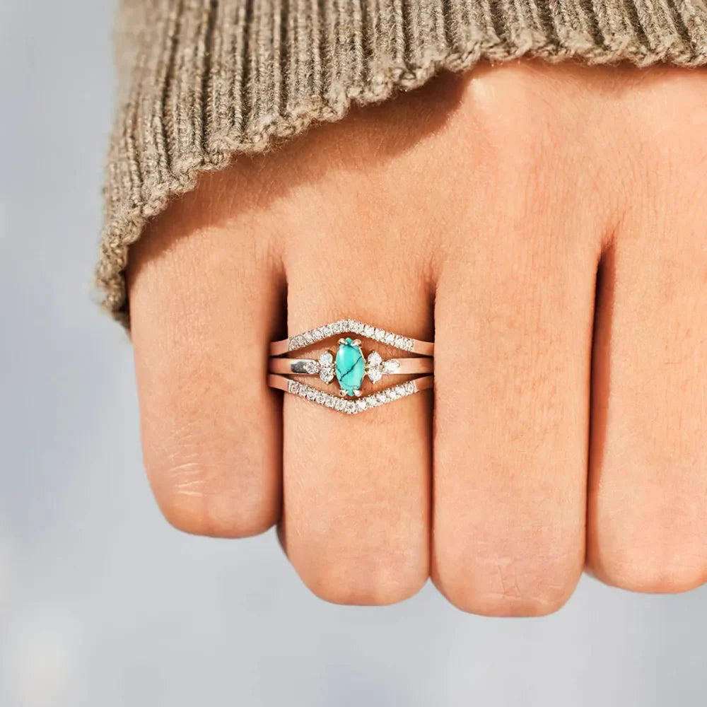 Turquoise chevron stacked ring set in silver with pave diamonds and oval turquoise center stone.