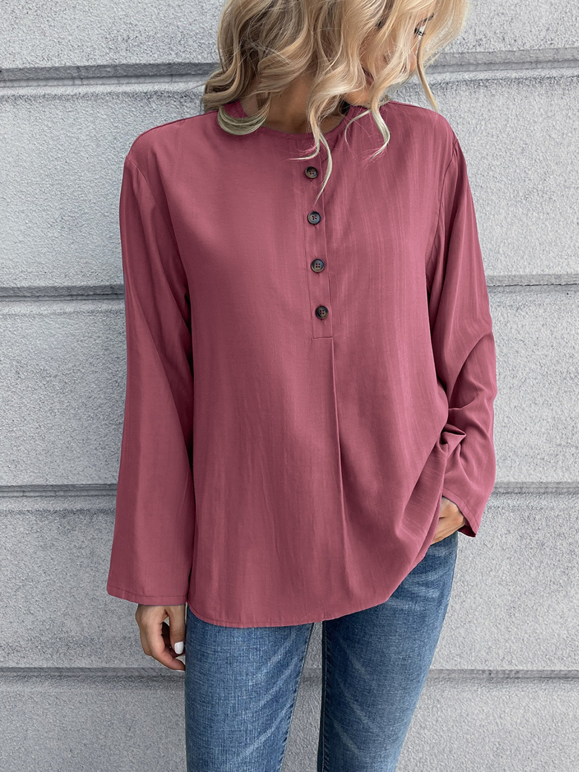 Mandarin collar button-down blouse in a muted rose color with a subtle vertical texture and button placket.
