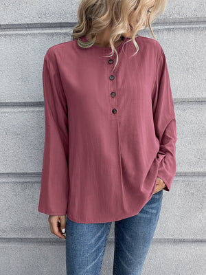 Mandarin collar button-down blouse in a muted rose color with a subtle vertical texture and button placket.