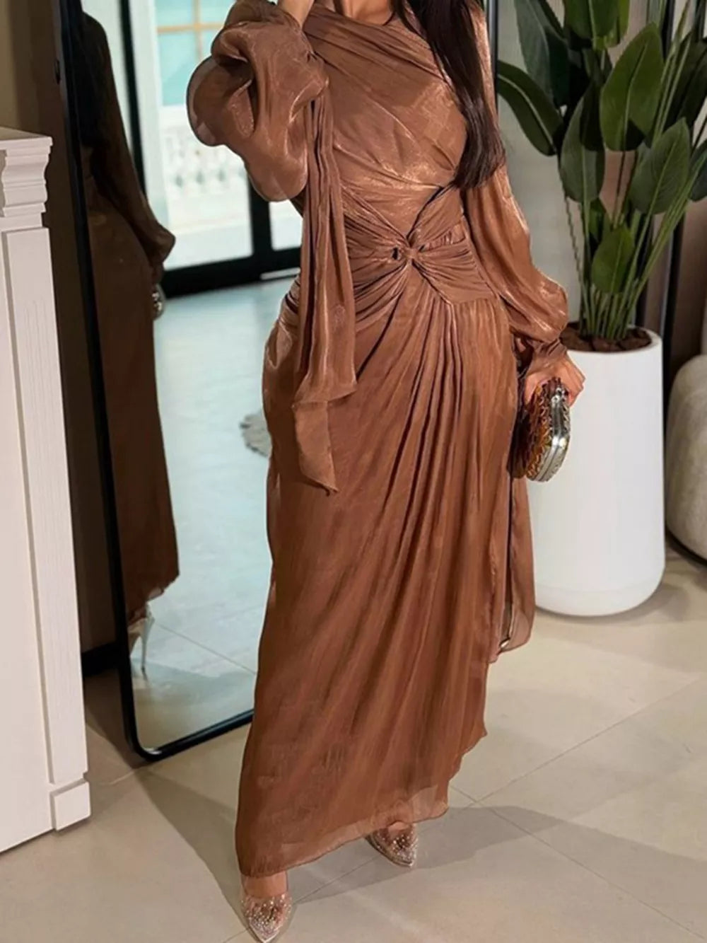 Brown ruched bodice maxi dress with twisted draped detail and balloon sleeves.