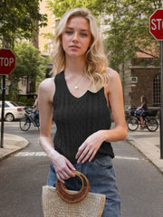 Black cable knit tank top with V-neck and textured pattern.
