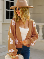 Floral puff sleeve open cardigan in caramel acrylic with light pink blooms.