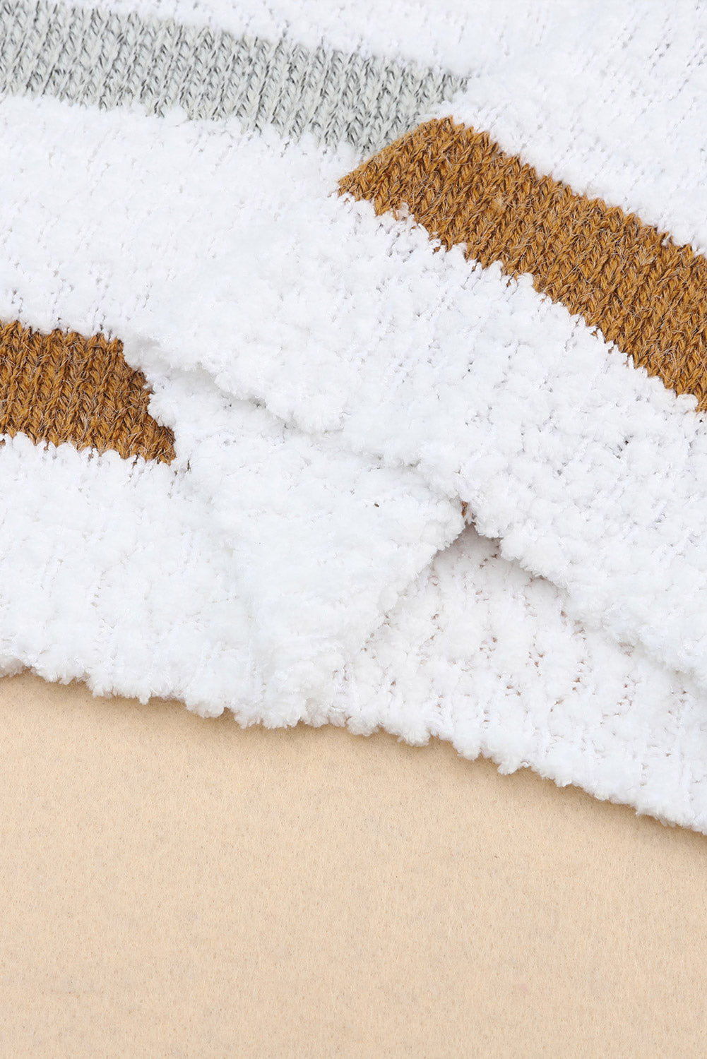 Textured stripe slouchy knit sweater in white with brown and grey accents, featuring a fluffy acrylic knit.