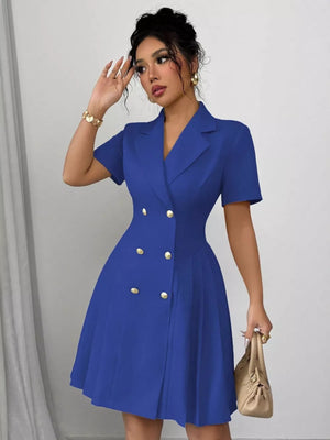 Blue double-breasted pleated blazer dress with gold buttons and short sleeves.