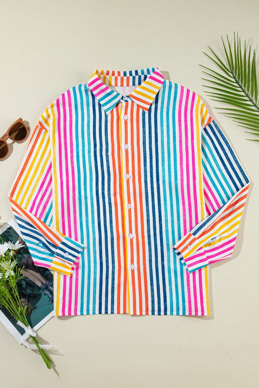 Rainbow stripe relaxed fit button-down shirt with a collar and long sleeves.