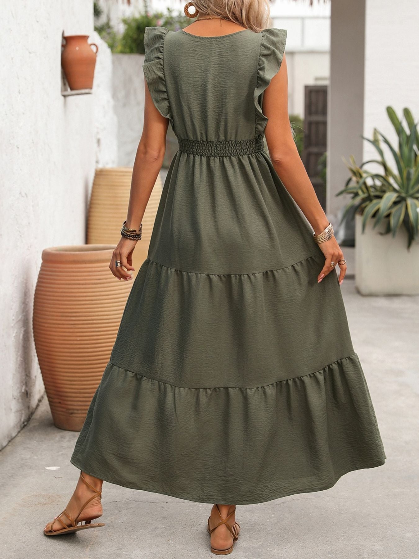 Olive green tiered maxi dress with ruffled sleeves and smocked waist, casual bohemian style