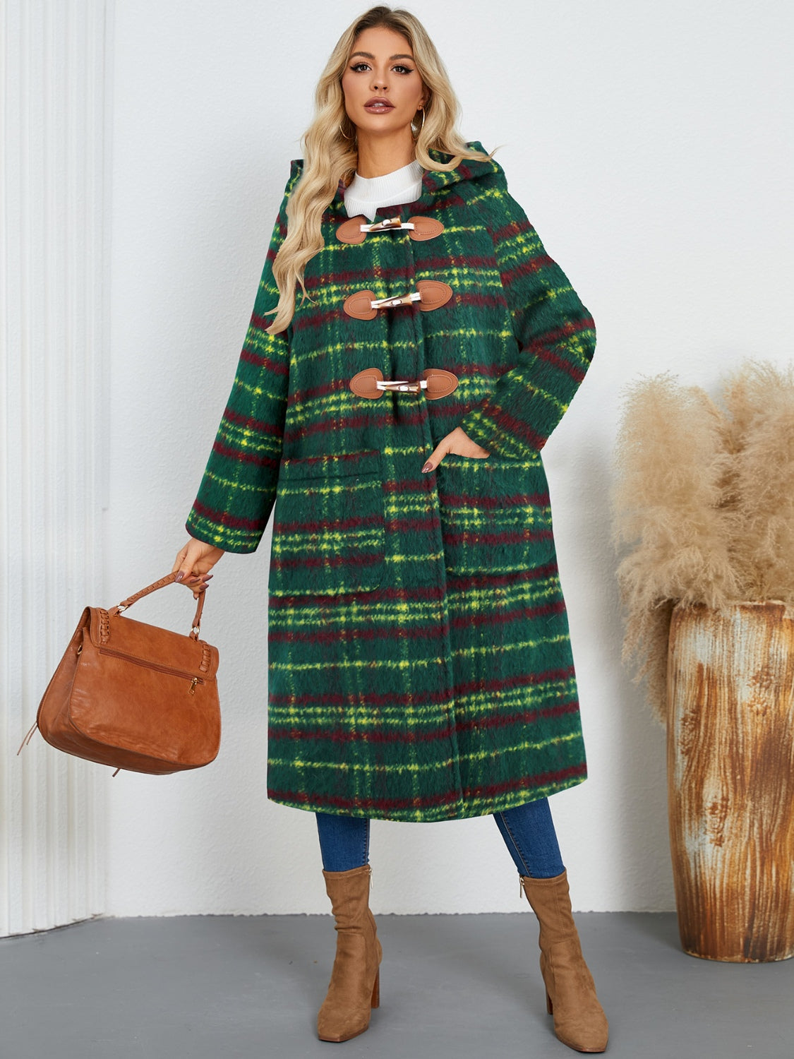 Dark green tartan toggle hooded coat with leather details and pockets.