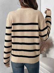 Tan waffle knit henley sweater with black stripes and button detail.