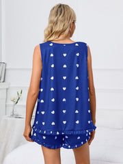 Royal blue heart print loungewear set with ruffled hem shorts and sleeveless top.