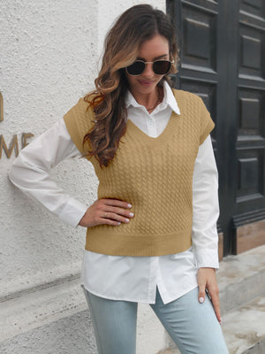 Khaki cable knit V-neck sleeveless sweater vest over white collared shirt