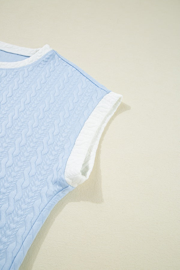 Light blue loungewear set with cable knit texture and white trim detail.