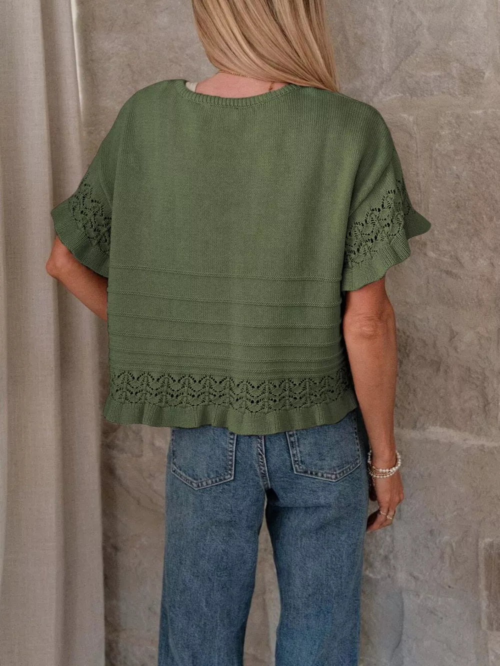Army green knit top with crew neck, short sleeves, and delicate lace trim.
