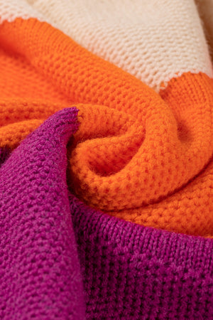Colorblock ribbed knit pullover sweater in orange, cream, and magenta acrylic.