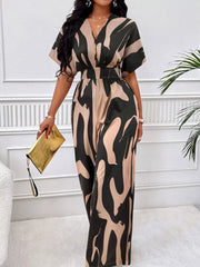 Chic abstract print wide-leg romper in black and khaki with V-neck and short sleeves.