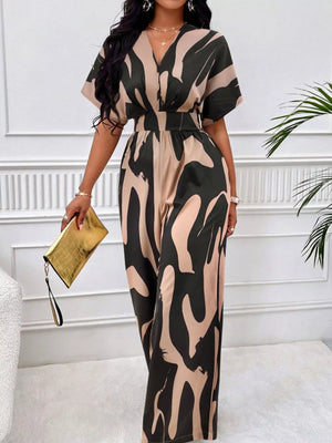 Chic abstract print wide-leg romper in black and khaki with V-neck and short sleeves.