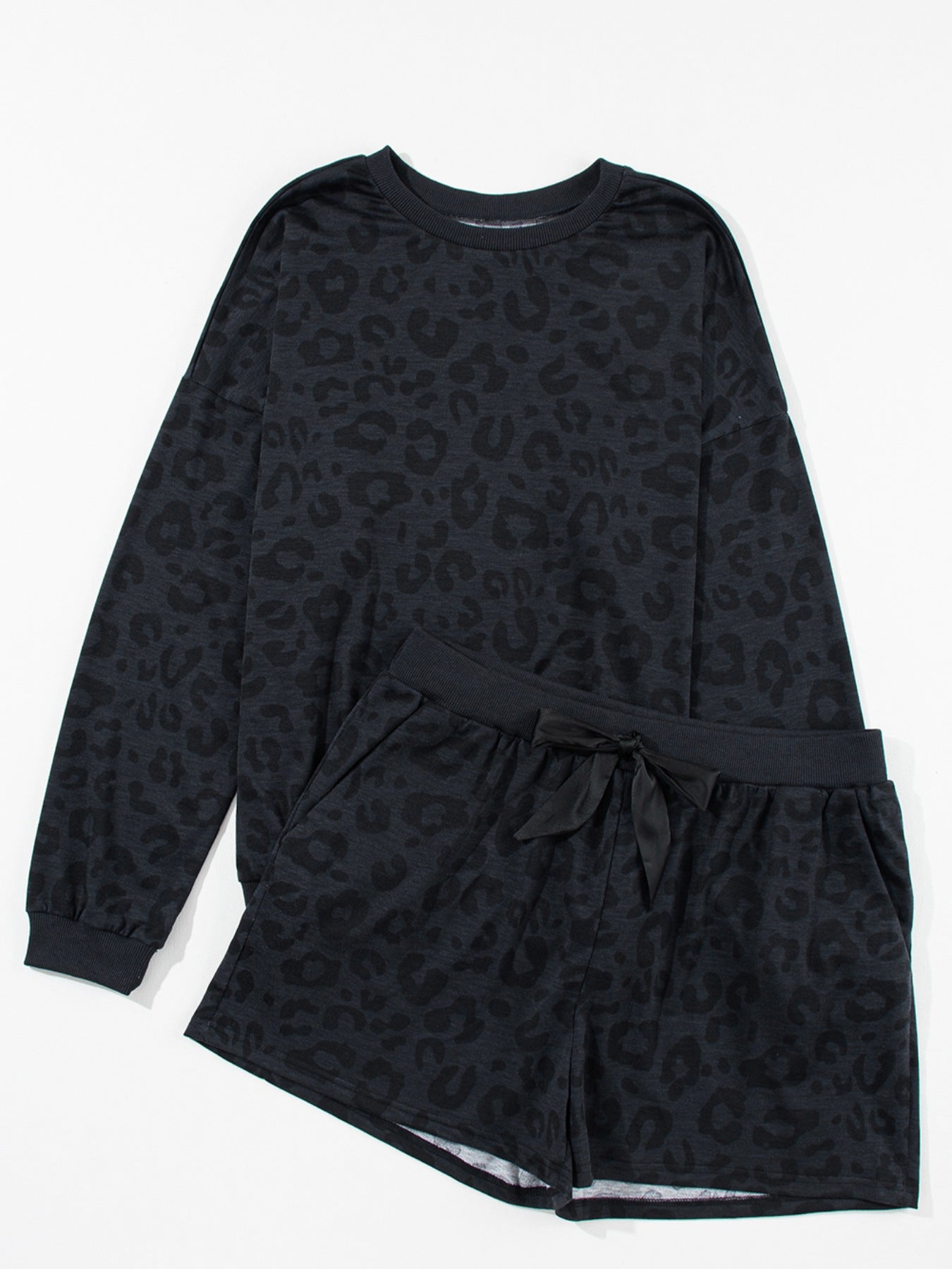 Dark gray leopard print pajama set with crew neck sweatshirt and drawstring shorts.