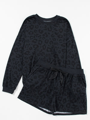 Dark gray leopard print pajama set with crew neck sweatshirt and drawstring shorts.