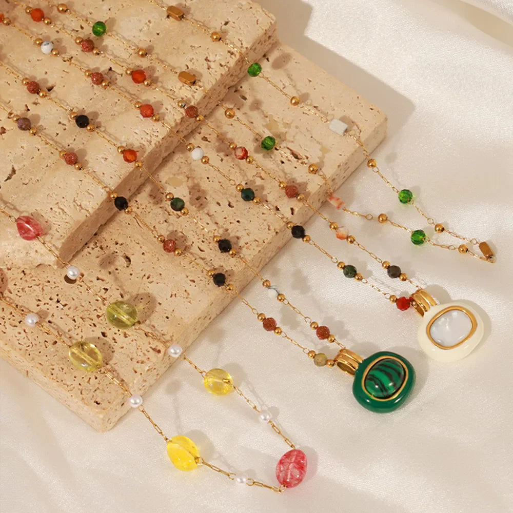 Gemstone Cascade Layered Necklace with gold chain and colorful beads in Styles A, B, and C.