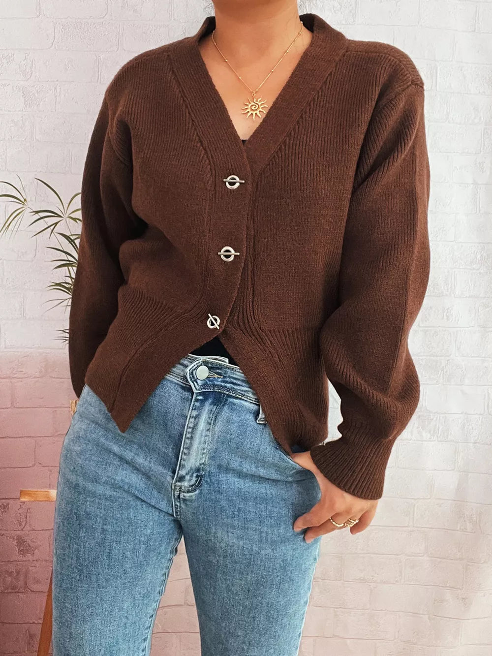 Brown ribbed V-neck button-through cardigan with silver hardware details.