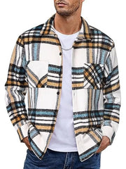 Men's plaid button-up shirt in white, brown, black, and blue cotton with two chest pockets.