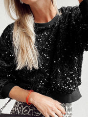 Black sequin embellished sweatshirt with ribbed cuffs and crew neck.