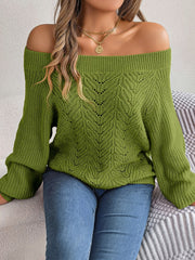 Moss green open-knit off-shoulder sweater with voluminous sleeves and leaf pattern detail.
