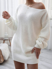White acrylic sweater dress with off-shoulder neckline and balloon sleeves.