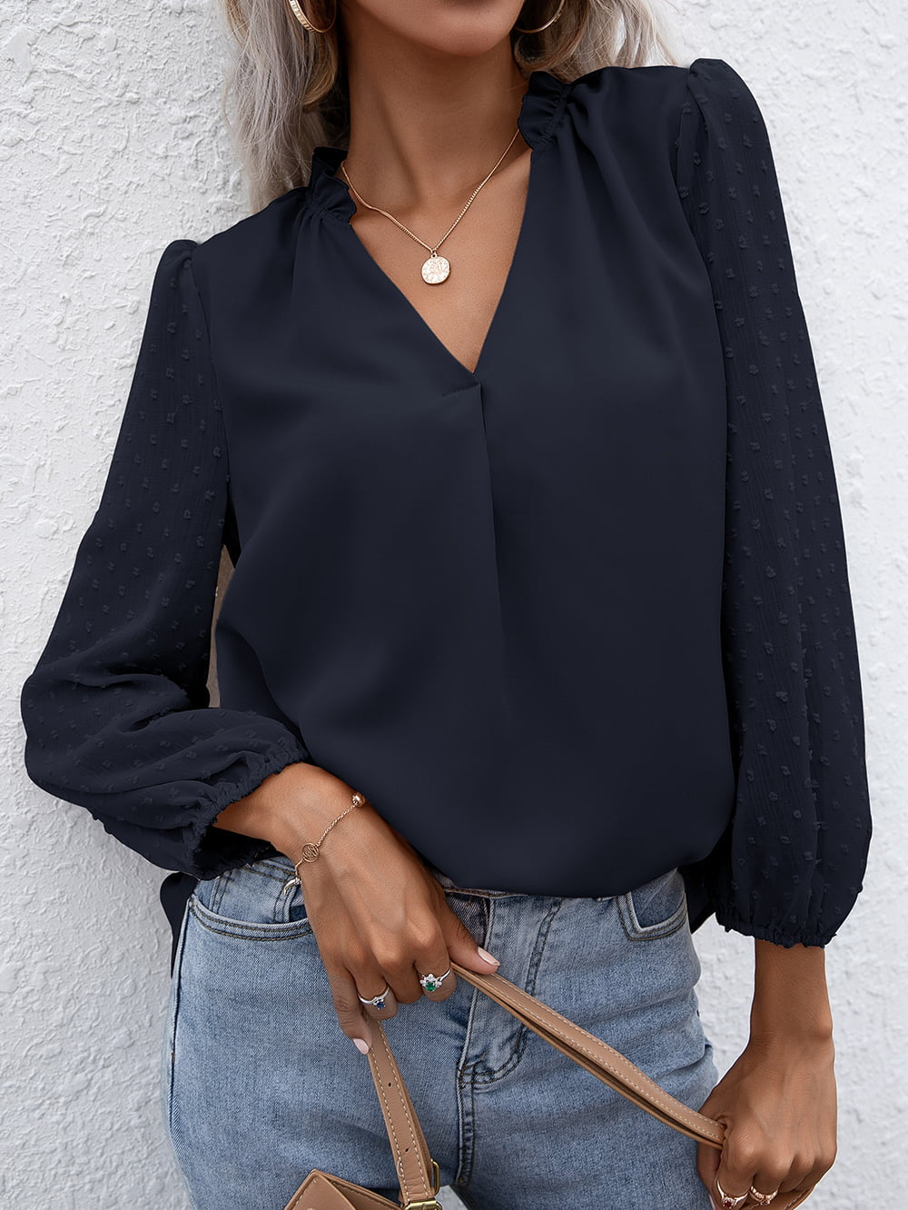Dark blue Swiss dot sleeve gathered blouse with V-neck and ruffled collar.