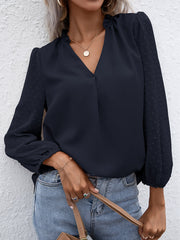 Dark blue Swiss dot sleeve gathered blouse with V-neck and ruffled collar.